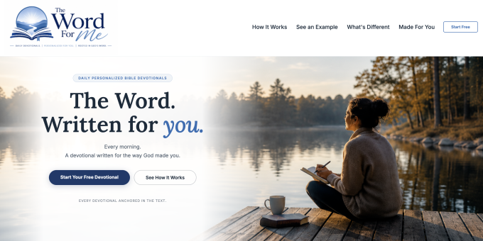 A woman sits on a dock by a lake, writing in a notebook.
